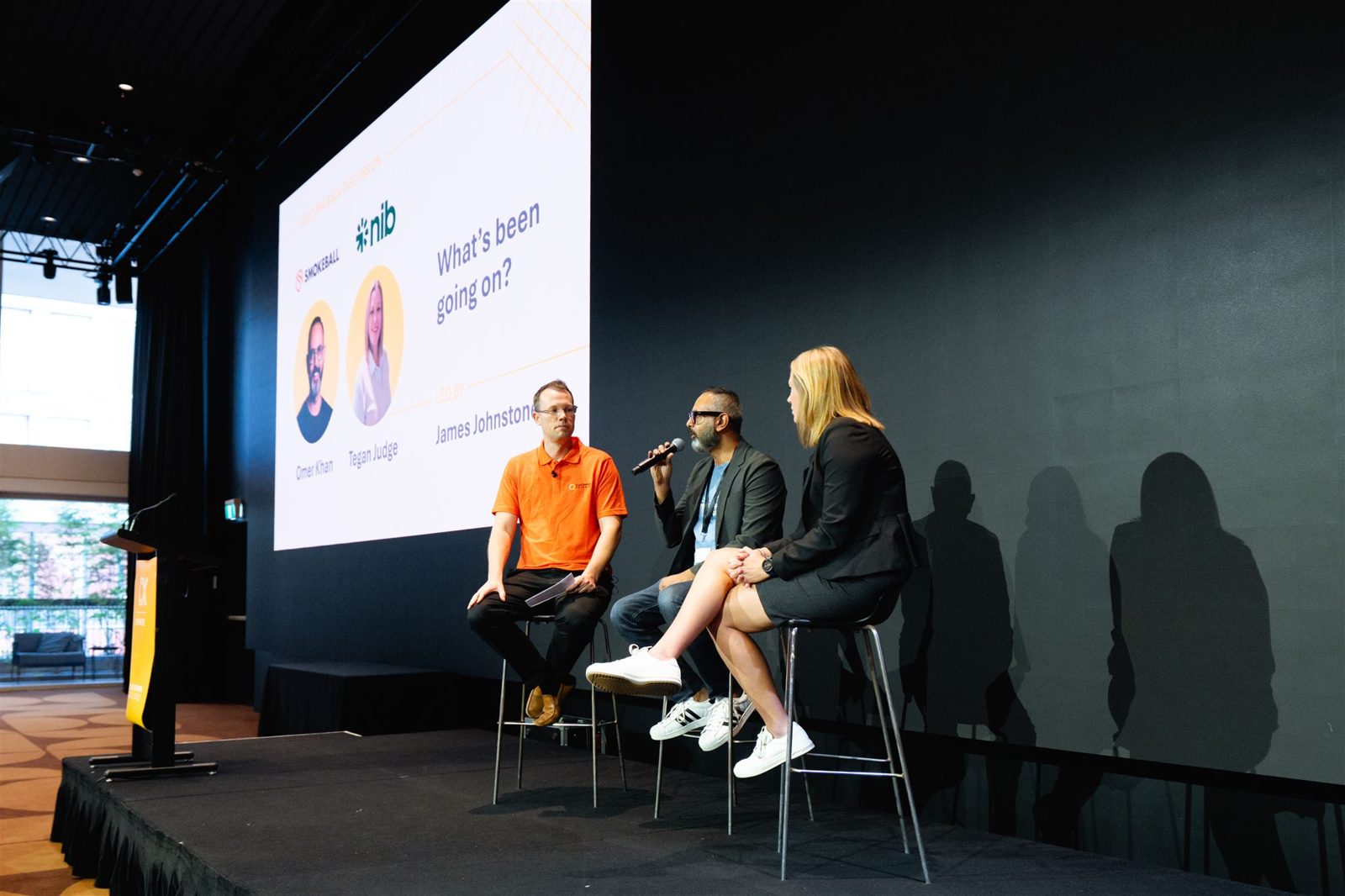Omer on a panel at CX Showcase